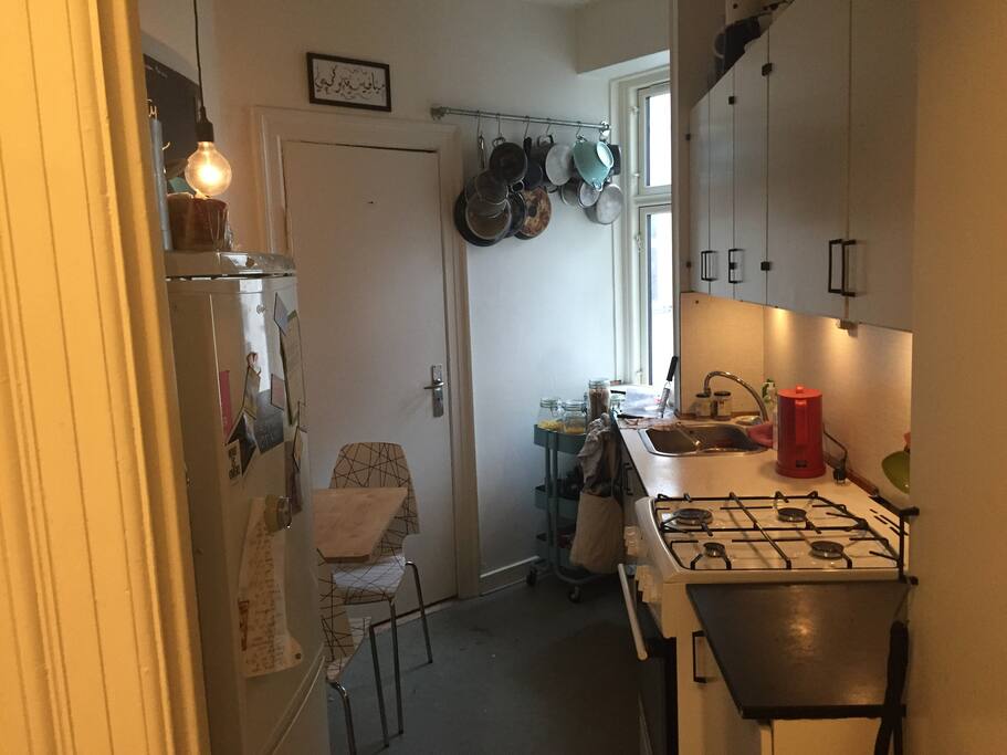 Kitchen. As you can see it's a bit small but there is space for 2 persons to sit.