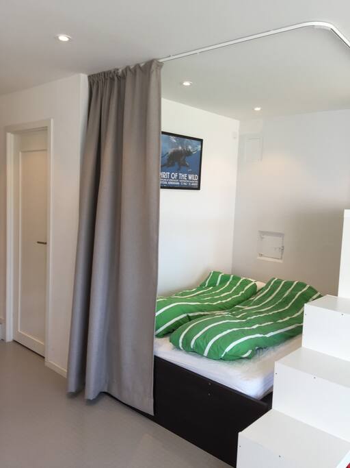 Double bed (140cm x 200 cm), with opaque curtains separating it from the lounge and the sunshine