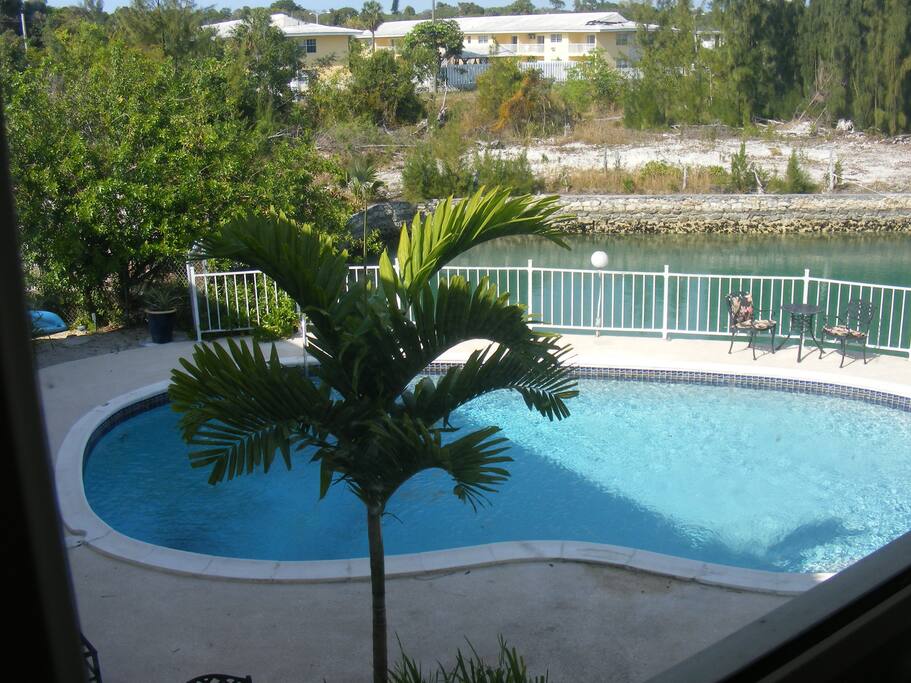 Walk down spiral stairs to reach pool.