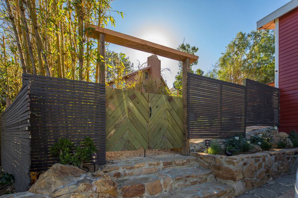 WELCOME This is the front gate, crafted with reclaimed wood from the site by our family friend who is an artisan woodworker - chevron design by me :-)