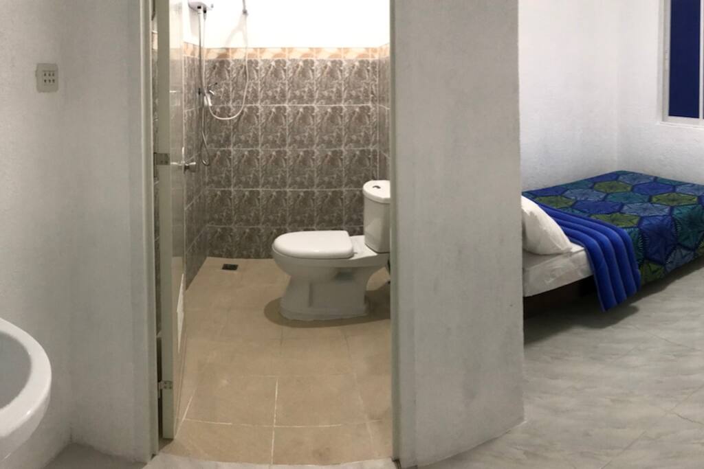CR, shower and Bed at room 1