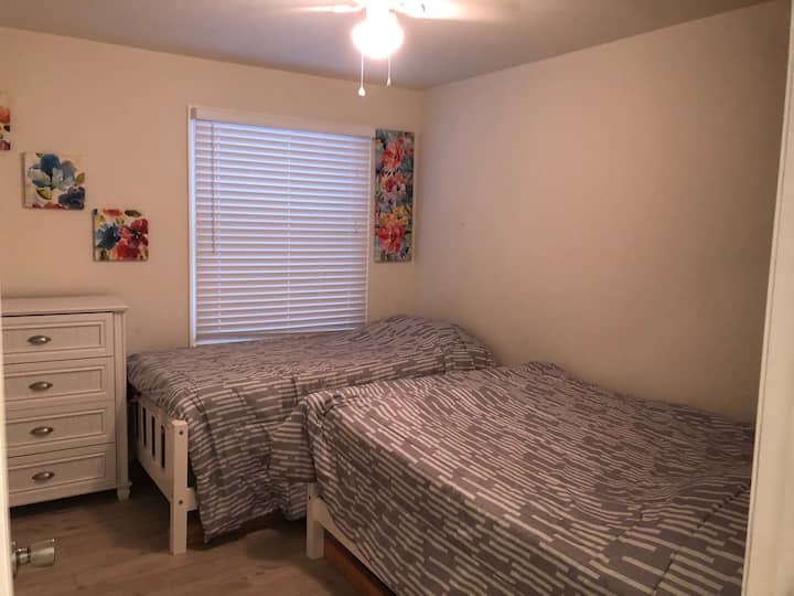 second bedroom with a full and twin bed