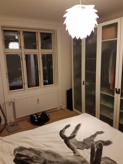 Big bedroom with double bed and two large closets