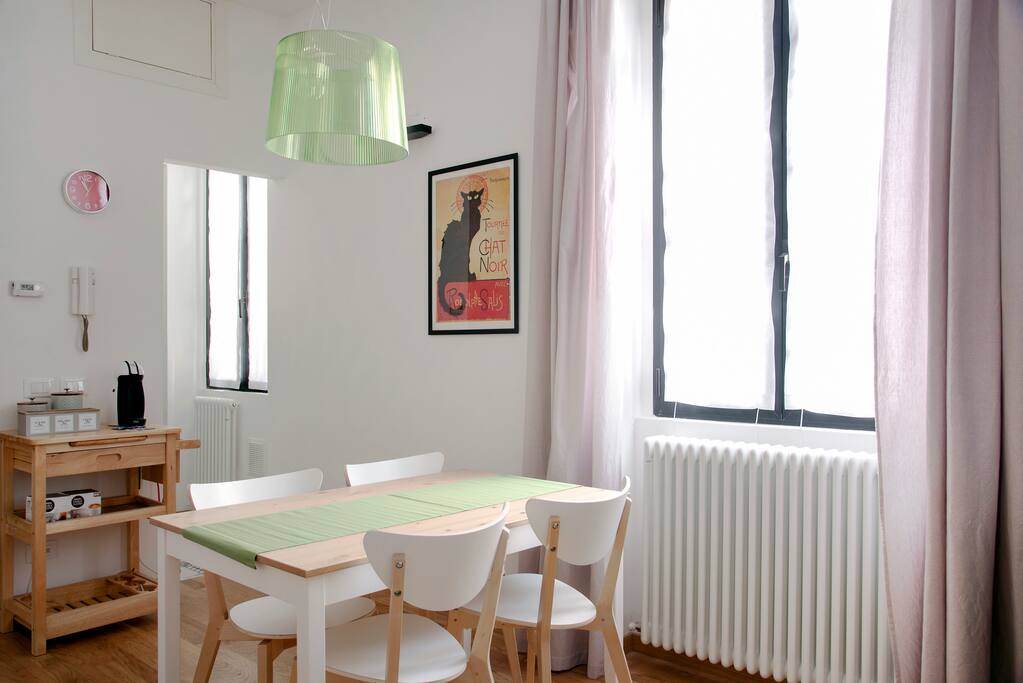 The dining table & also you can see the kitchen's entrance