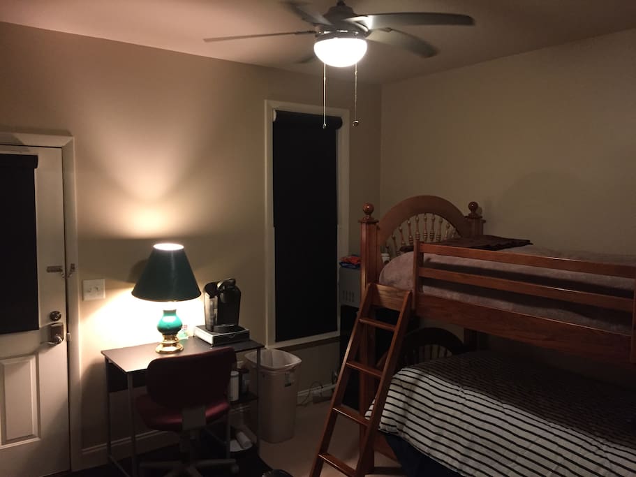 Bunk beds with desk, lamp, and Kurig
