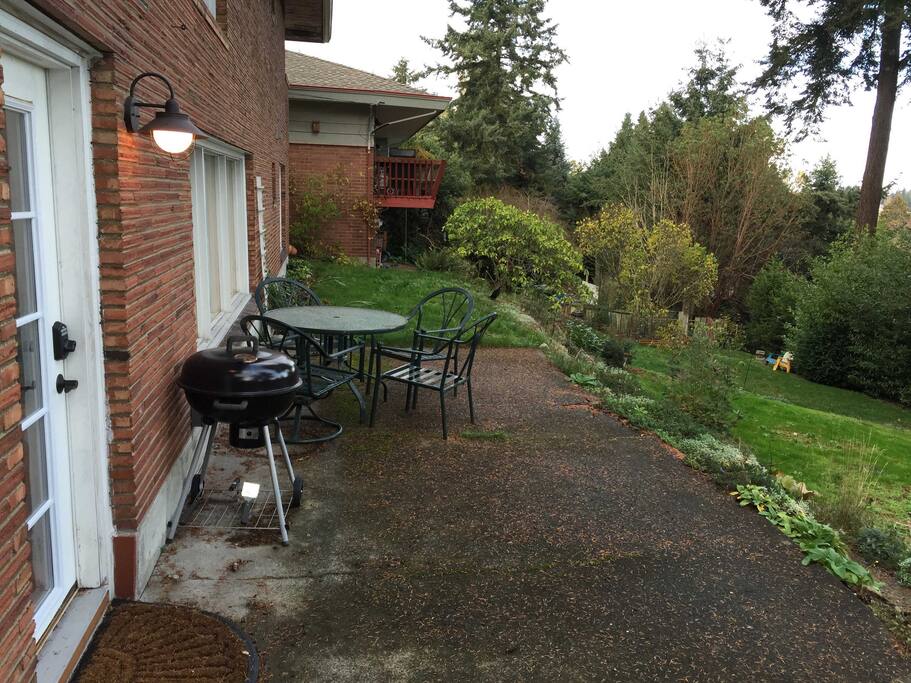 Entrance, private patio, and charcoal grill (photo taken in autumn)