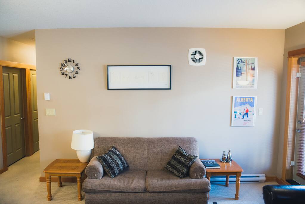 The living room has a pull out sofa bed and a doorway to the large balcony where you can enjoy the fresh mountain air.