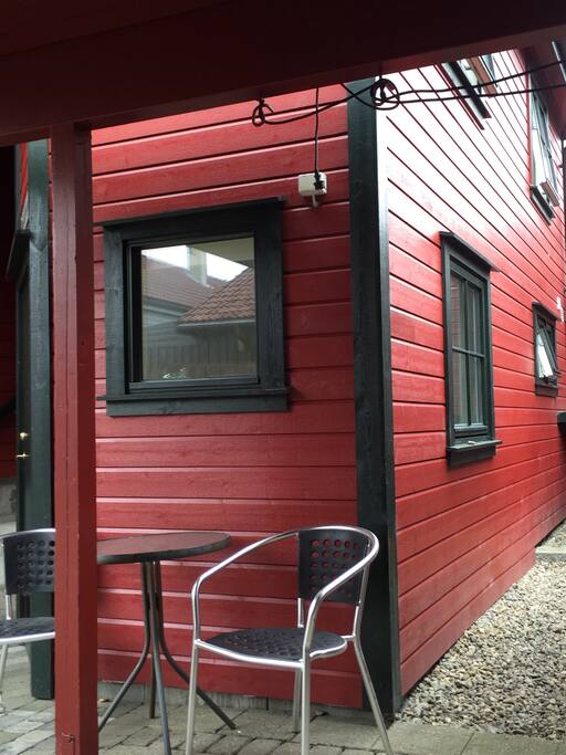 Smoking table outside entrance door.