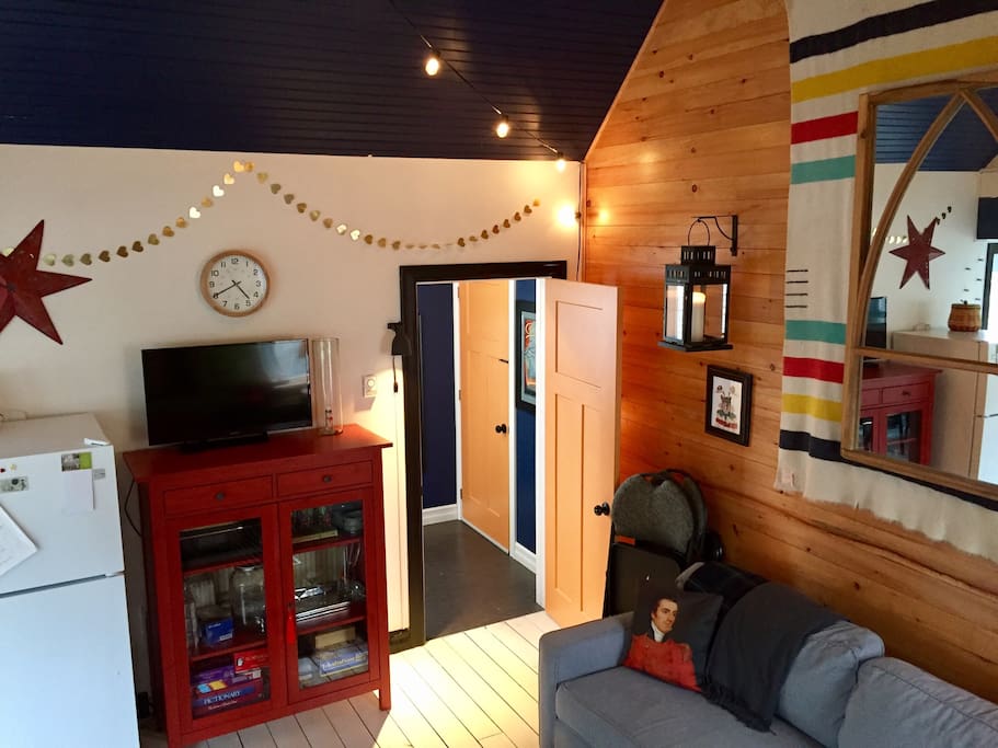Vaulted ceiling, string lights, second door to laundry/pantry.