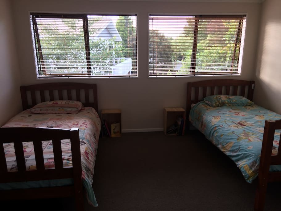 Second bedroom has 2 king-single beds, with access to bathroom