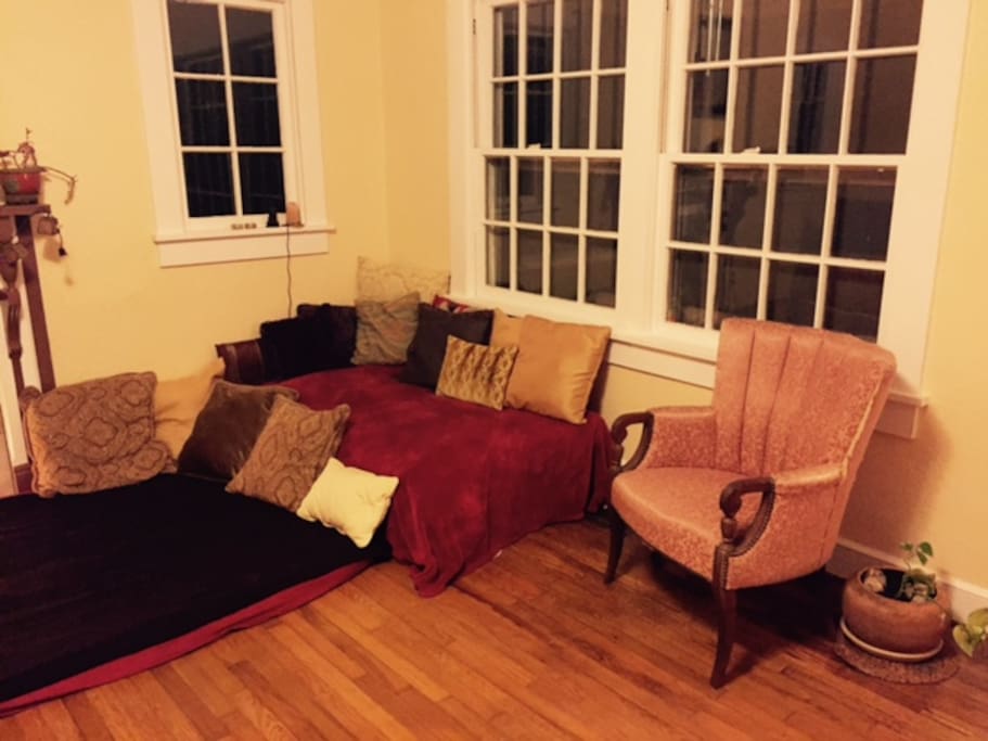 Futons in living room that can be used as beds if needed