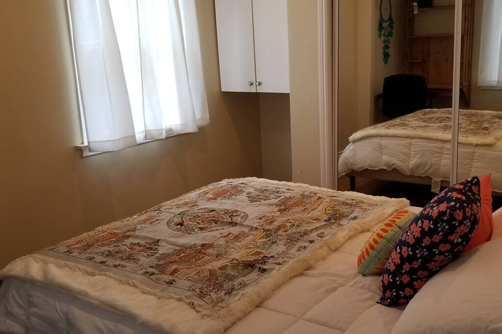 Plushy, comfy bedroom with a view