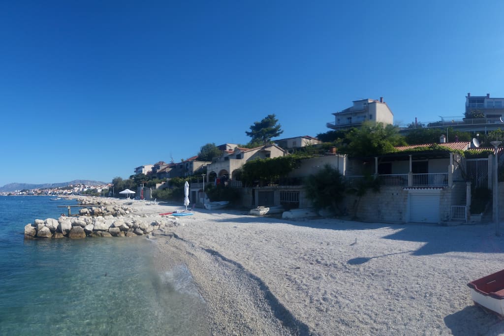 View of the estate from the beautiful pebble beach, just steps away from your future apartment.