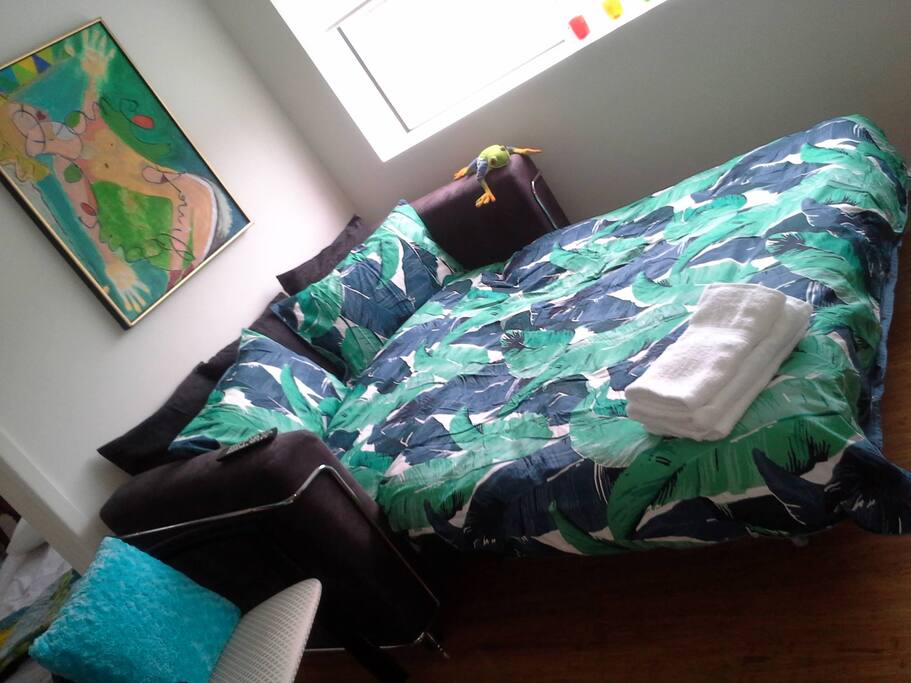 bed bathed in afternoon sunlight