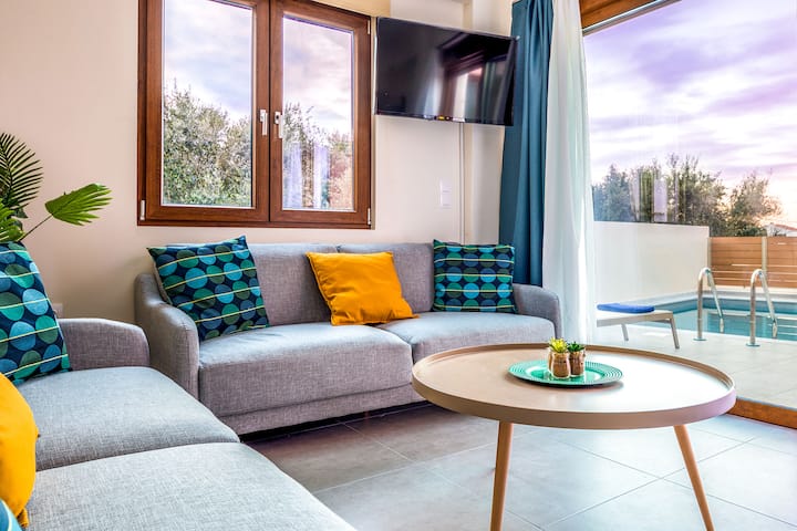 Ground Floor: Spacious open-plan living area filled with natural light and sea views