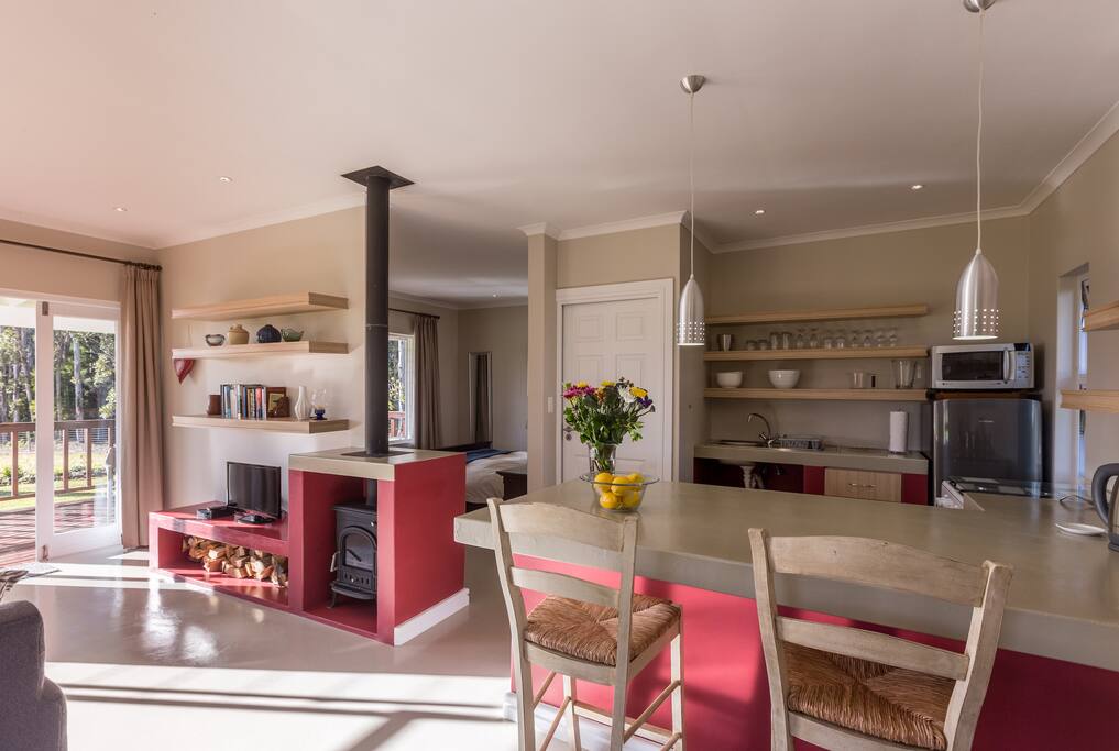 Light modern open plan kitchen with all the necessary kitchen essentials.