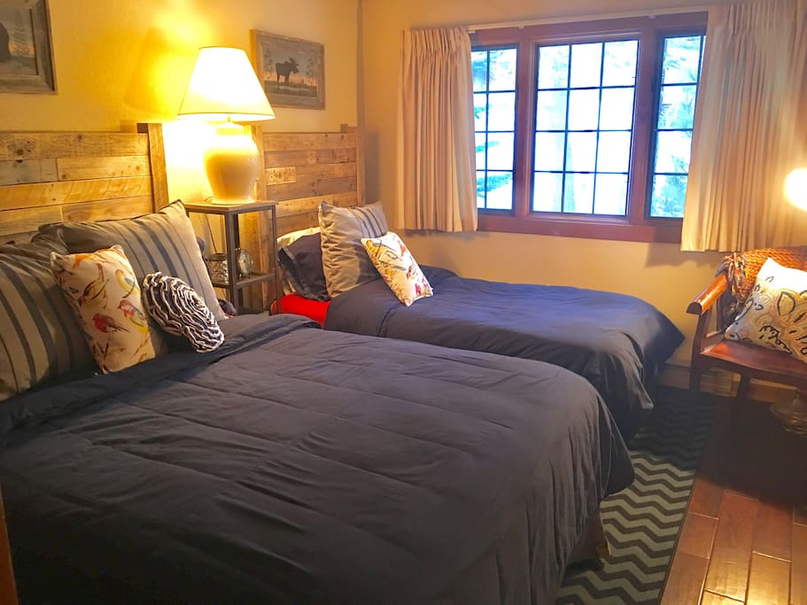 Private sleeping area, "guest room", includes a queen bed and a twin bed.