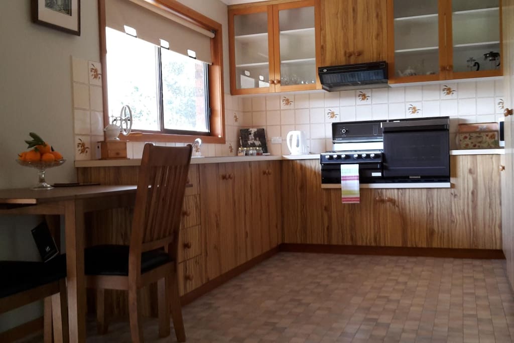 Sunny kitchen and dining area with everything you need for your convenience
