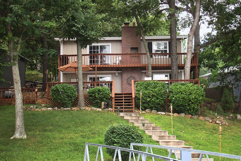 Water front location in a cove. Flat grassy lawn with easy access to lake dock.