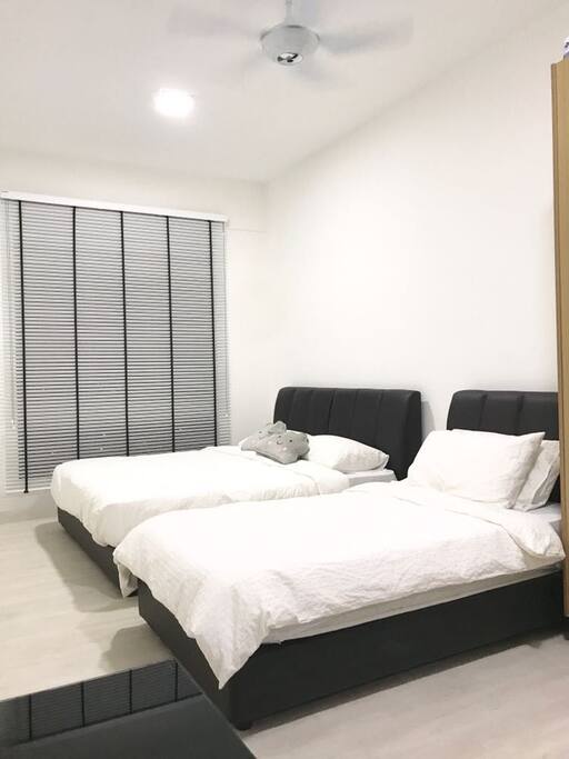 King size bed and a single bed first bedroom