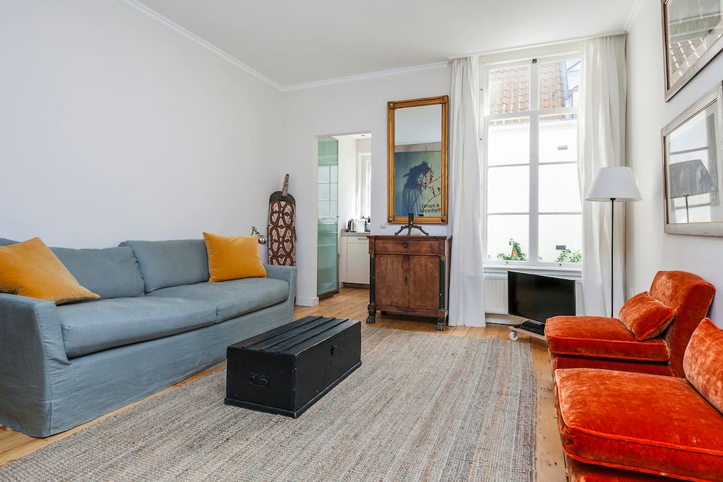 Spacious living room overlooking the courtyard gardens at the back.