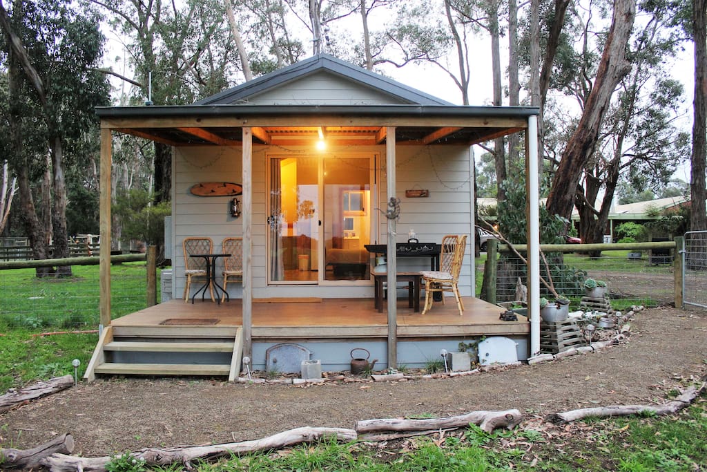 Front of cabin looking out to open paddocks and gardens.