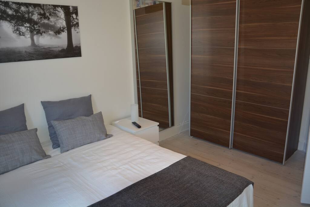 Full figure mirrors to check out your outfit and a roomy wardrobe with plenty of hangers for your clothes. Iron and ironing board.