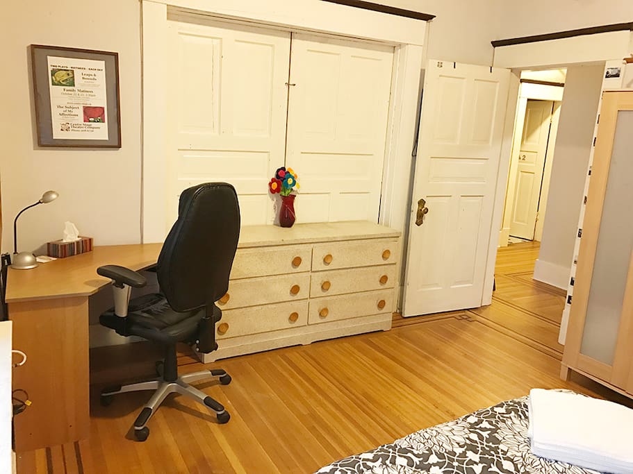 There is a desk in this room and a dresser that you can use.