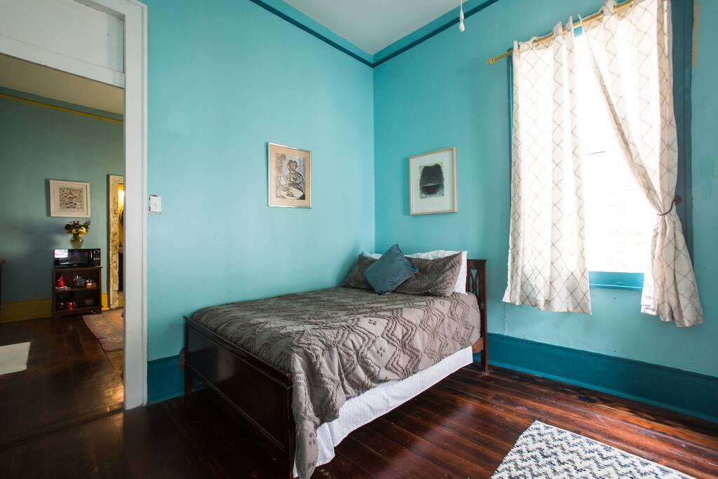 The layout of our spot is two bedrooms followed by a bathroom. This is the first bed, full size.