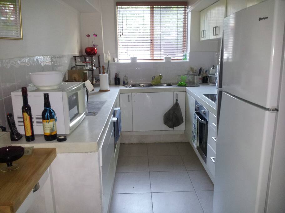 Kitchen separate from dining and ounge area