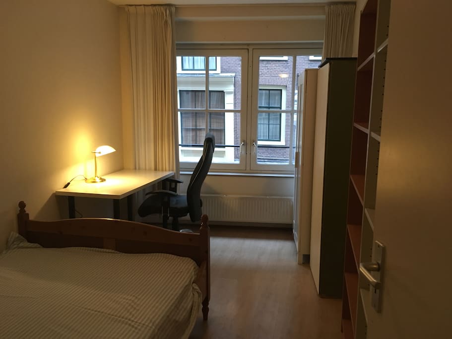 Private room with closets, desk and fantastic view on the Zeedijk.