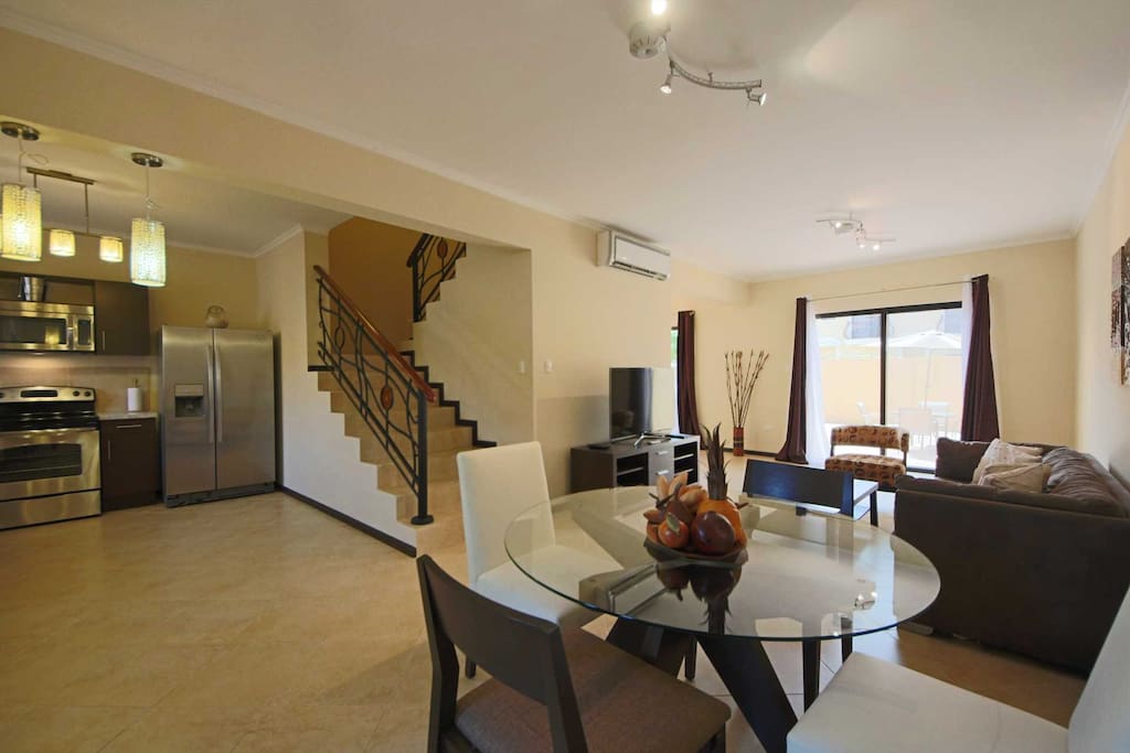 Open plan living area with 4-seat dining table