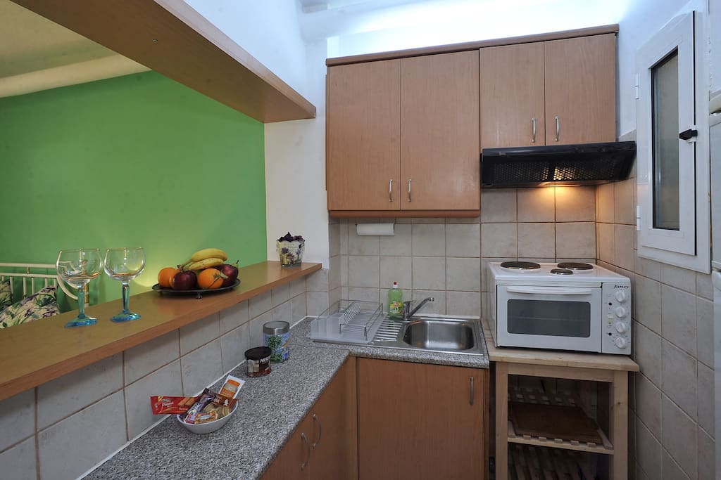 Convenient kitchenette with spacious fridge and storage space