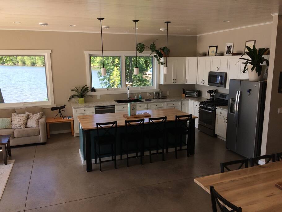 Open concept kitchen, dining and living space