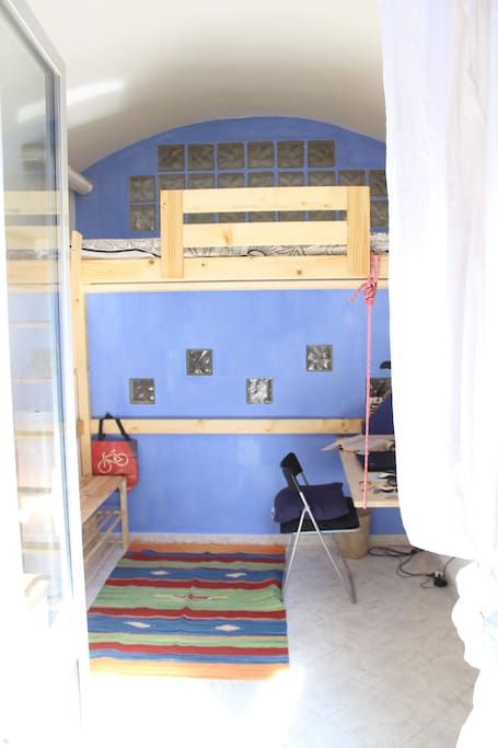 the private room with loft bed (behind there's the kitchen)