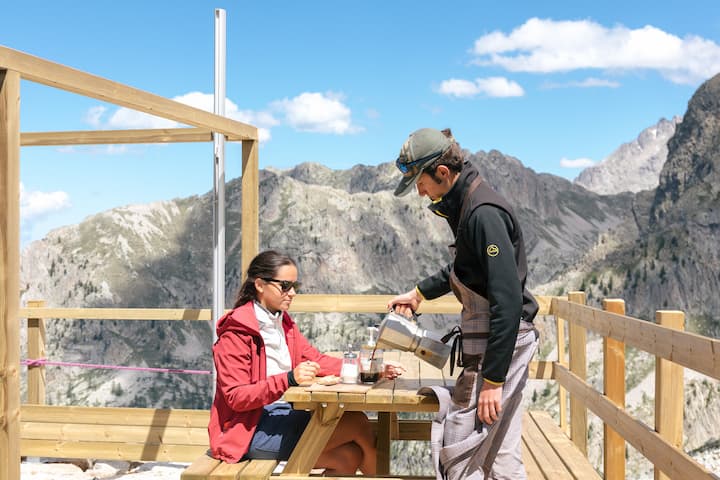 photo of a man is pouring coffee for a woman