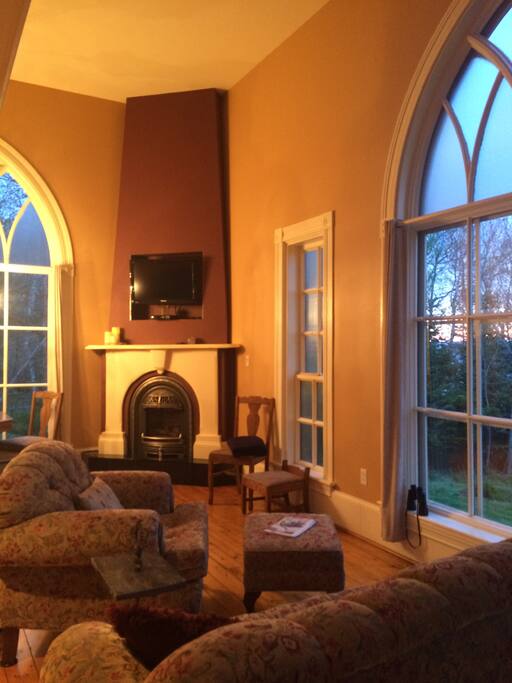 Large church windows let natural light and nature shine.