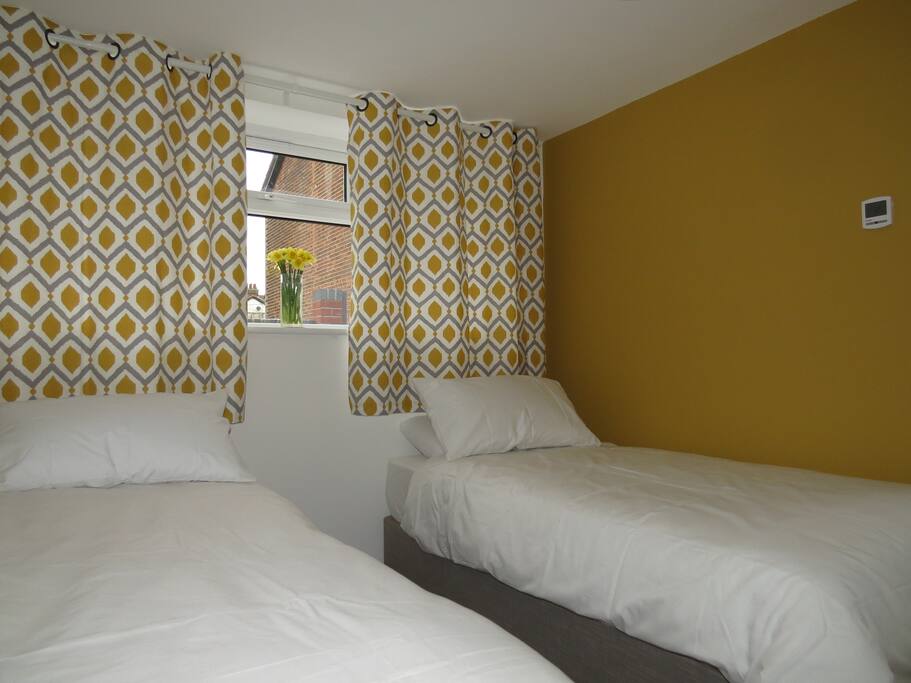 The two single beds link to make a very large double bed
