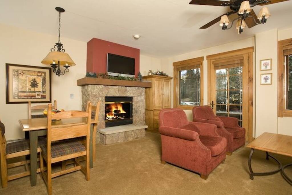 The living area is spacious and cozy, complete with fireplace.