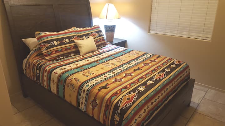 Front guest bedroom - Queen Size bed with chest of drawers, under-bed drawers, night stand, and 32 inchTV with Xfinity via Roku