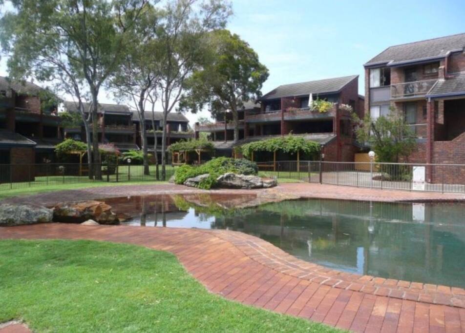 The apartment complex, our building is at the back. There is next to no road noise from our apartment.