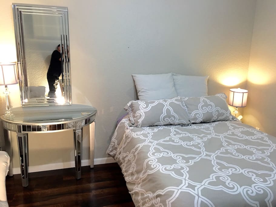 Desk and European pillow top Queen size bed.