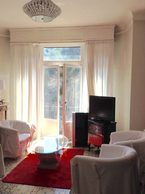 The living room with the bay window