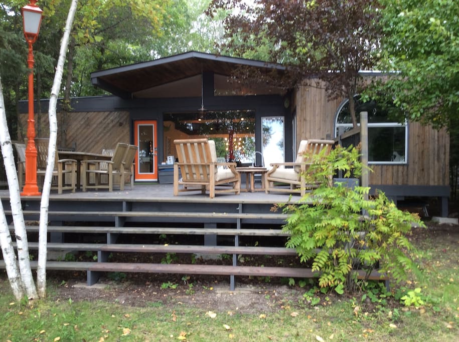 Private deck with teak dining and lounge area
