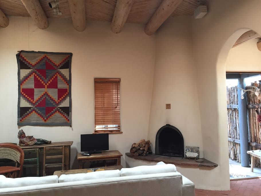 Living room with kiva fireplace.
