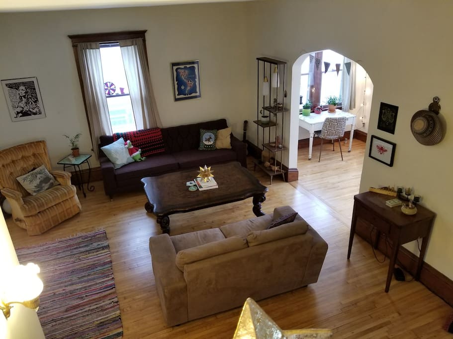 Spacious living room with comfy couches and hardwood floors.