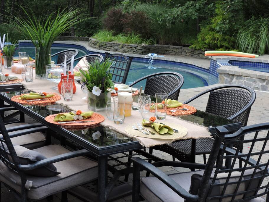 Outdoor Dining: Everything you need for poolside dining features two long rectangular tables with umbrellas for 16-20 people as well as 3 bistro tables and numerous poolside lounge chairs. Hook up your cell phone for outdoor patio music. The remote control outdoor lighting at night is easy to use, exquisite and very romantic!