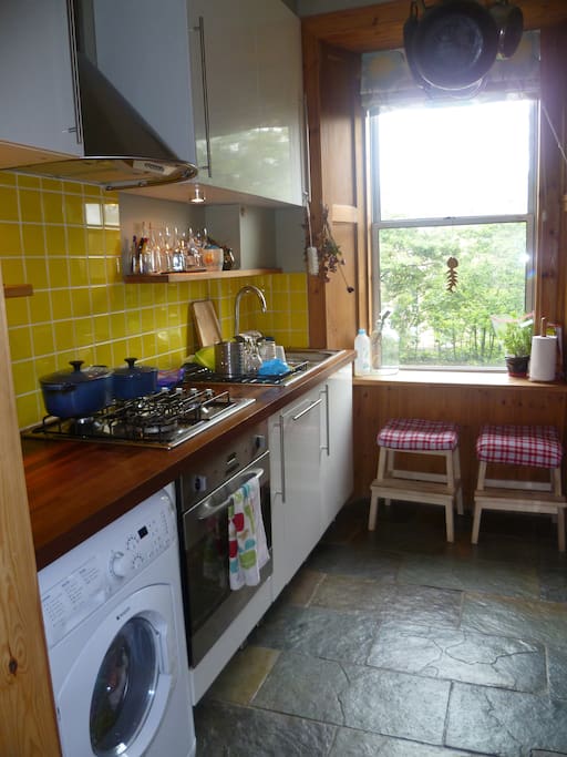 Kitchen with washing machine and dishwasher.