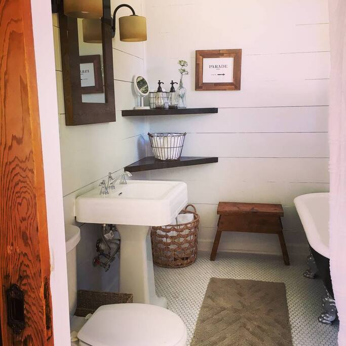 Bathroom with all the amenities- shampoo, conditioner, bathwash, towels, hair dryer.
