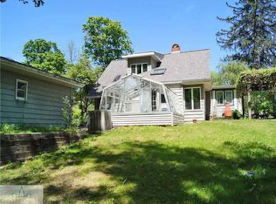 Backyard green house and pergola